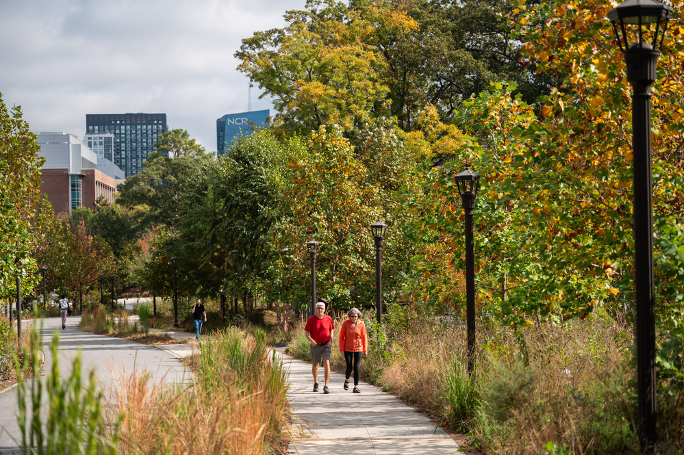 two people walking the path at EcoCommons